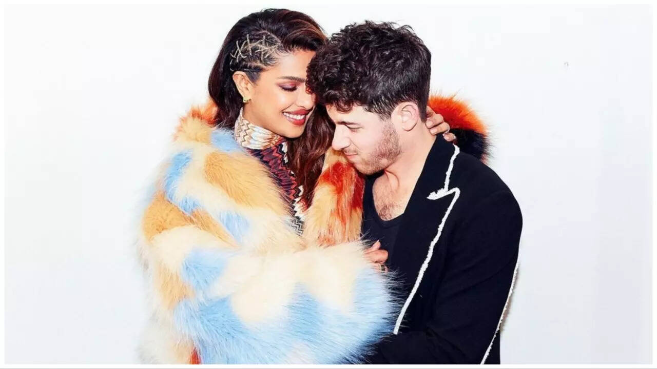 Priyanka Chopra hugs hubby Nick Jonas in Love Again BTS video.