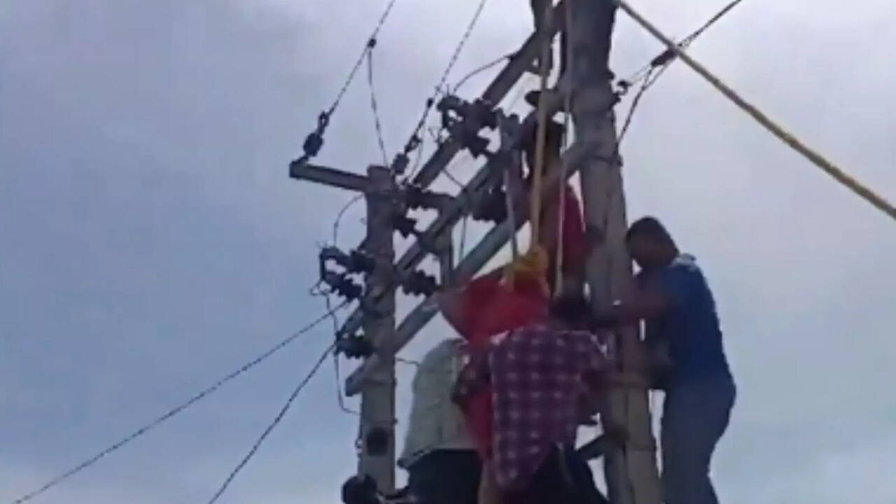 ​Woman Climbs On Electric Pole When Husband Refuses Her Lover Of 7 Years To Contribute To Household Expenses, WATCH