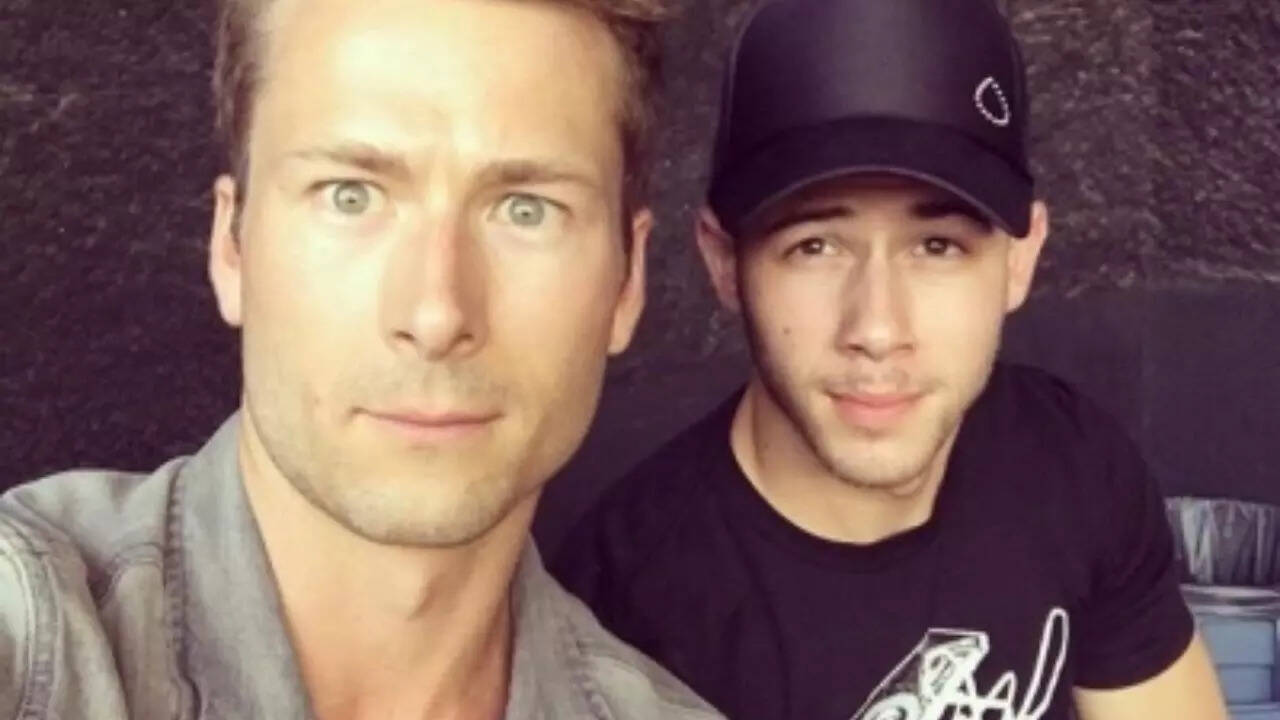 Nick Jonas and Glen Powell