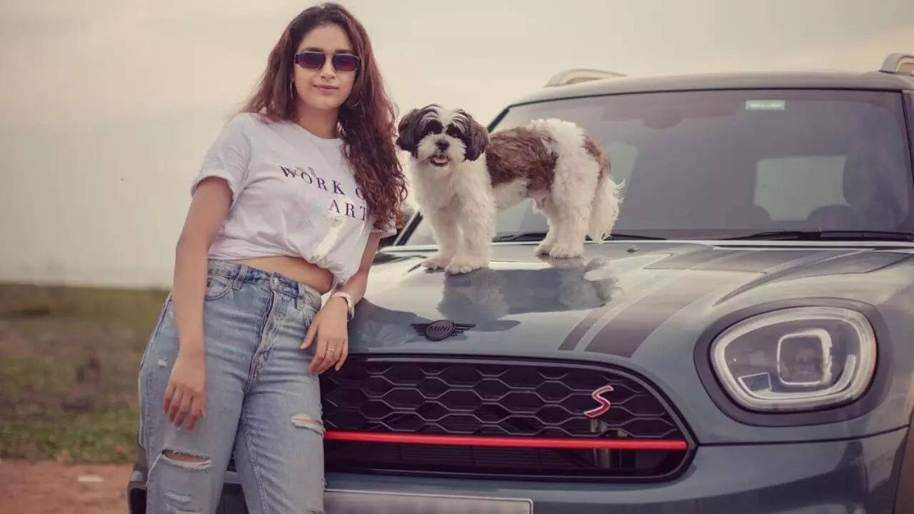 Keerthy Suresh poses with her expensive car