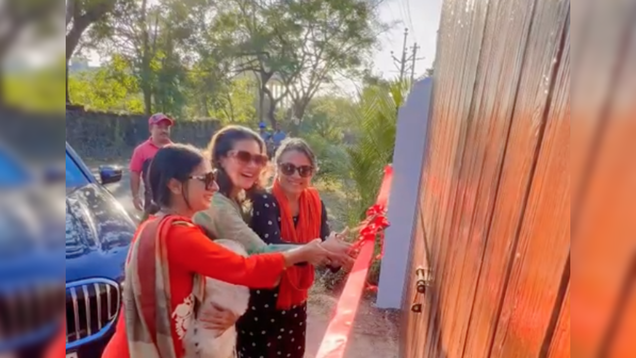 Kajol and the family cutting the ribbon before entering mom Tanuja's newly renovated home