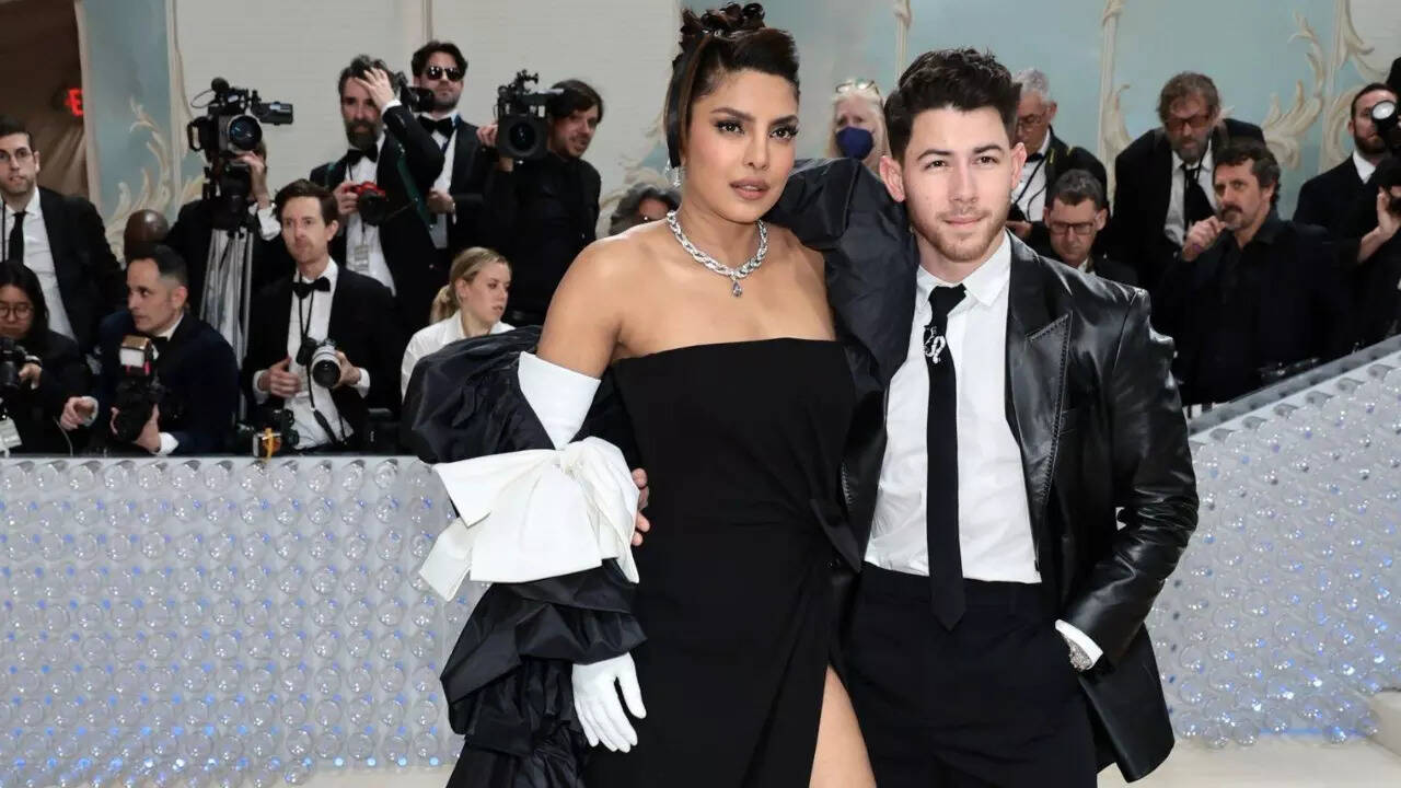 Priyanka Chopra and Nick Jonas twin in black and white ensembles.